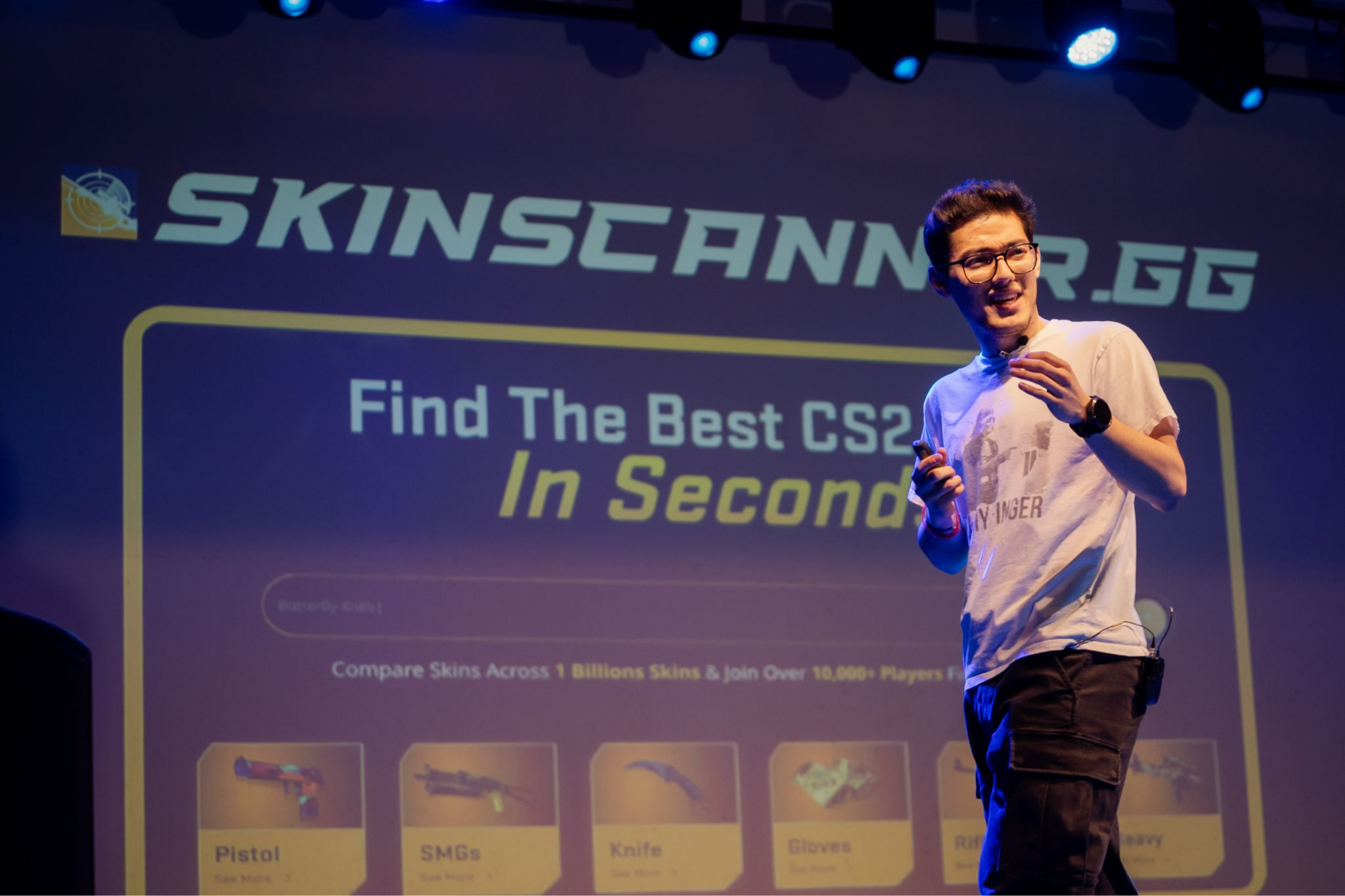 Skinscanner.gg co-founder Josh Sinclair presenting on stage at a startup demo day event
