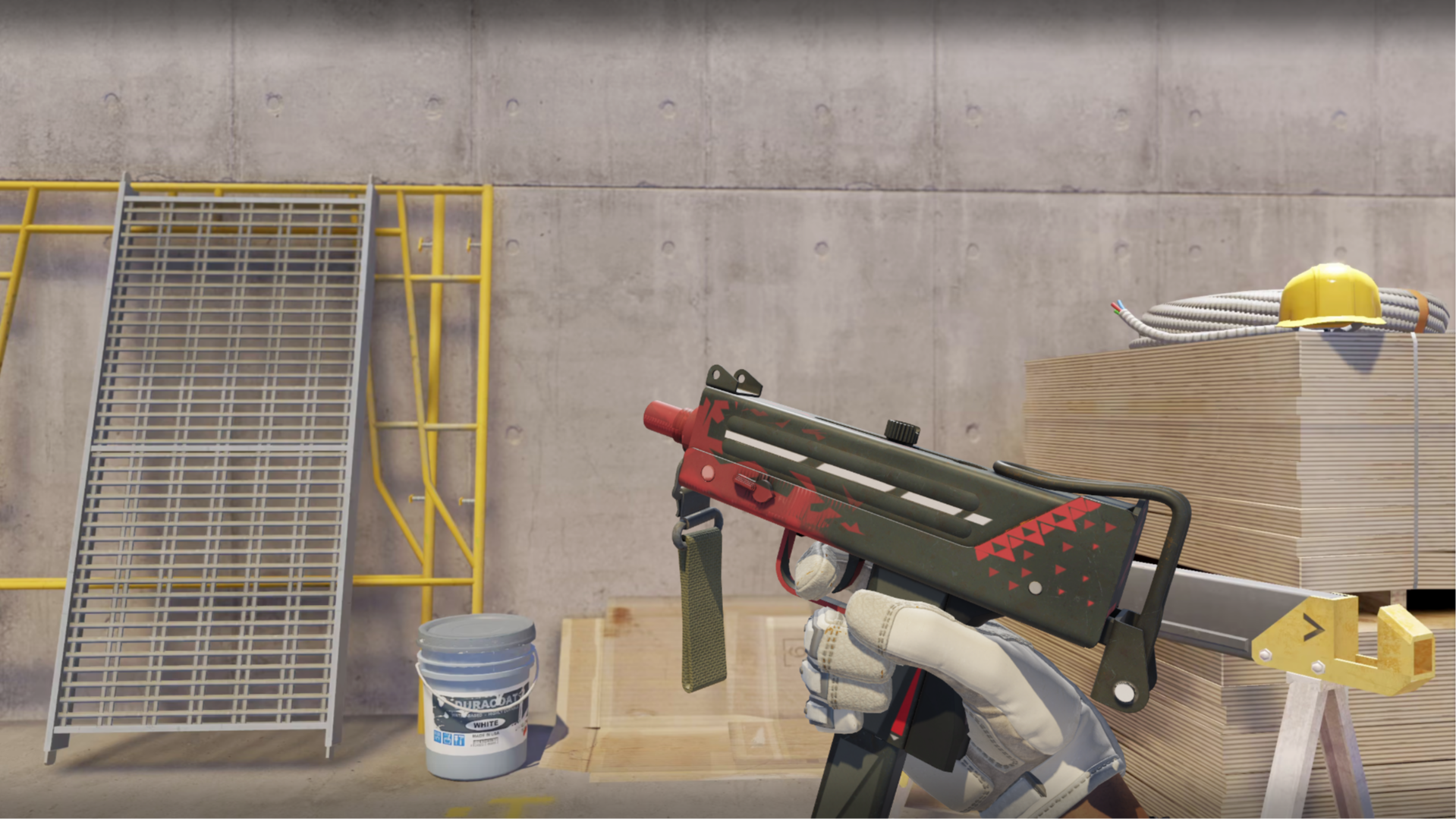 MAC-10 | Tatter with red triangles on an olive-green body and red muzzle, shown in-game at a construction site